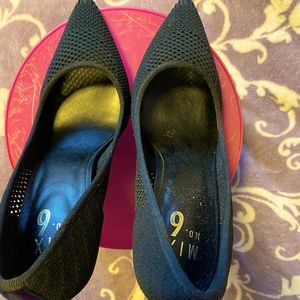 Black pointed toe pumps